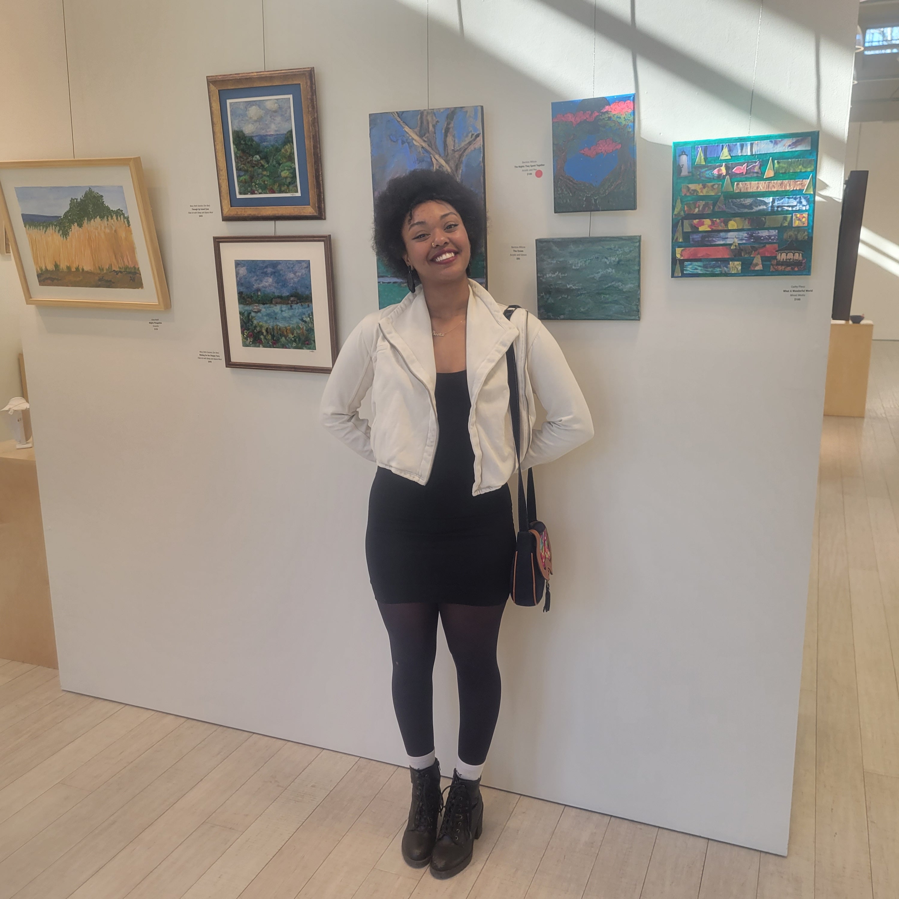 Bernica Wilcox in front of her art piece at Featherstone Gallery